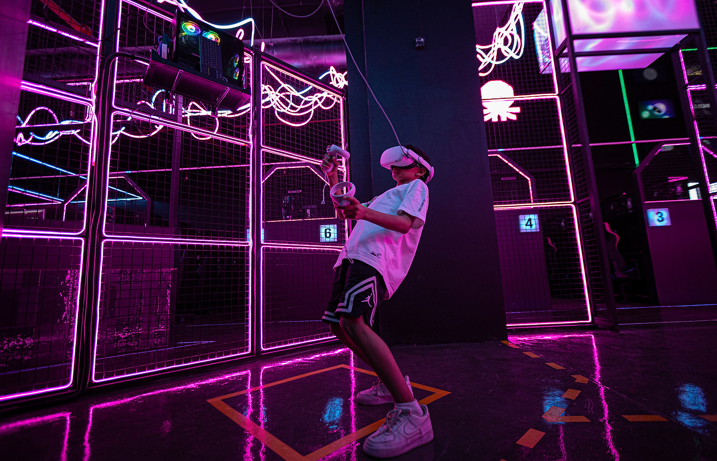 Player wearing a VR headset in the ZNTRX VR arena